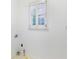 Empty laundry room with neutral flooring, white walls and window with white shutters at 2773 Brookgrove Se Ln, Atlanta, GA 30339