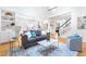 Bright open-concept living room with high ceilings, hardwood floors, and modern decor at 2773 Brookgrove Se Ln, Atlanta, GA 30339