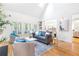 Bright living room with large windows and hardwood floors and modern furniture at 2773 Brookgrove Se Ln, Atlanta, GA 30339