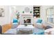 Cozy living room featuring a fireplace, built-in shelves, and modern decor at 2773 Brookgrove Se Ln, Atlanta, GA 30339
