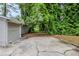 A backyard featuring a patio and mature trees, offering a natural view at 2796 Green Trail Dr, Atlanta, GA 30349