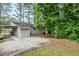 View of the backyard, showing the exterior of the house and some green space at 2796 Green Trail Dr, Atlanta, GA 30349