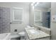 A bathroom features a tiled shower, granite countertop, and a modern design at 2796 Green Trail Dr, Atlanta, GA 30349