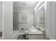 Bathroom features a granite countertop, modern vanity, tub, and tiled shower at 2796 Green Trail Dr, Atlanta, GA 30349