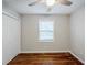 Bedroom featuring hardwood floors, window, and closet offering practical storage at 2796 Green Trail Dr, Atlanta, GA 30349