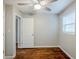 A well-lit bedroom features hardwood floors, a window, and a view of the entry at 2796 Green Trail Dr, Atlanta, GA 30349