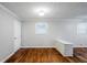 Bright living room with hardwood floors, large windows, and fresh white paint at 2796 Green Trail Dr, Atlanta, GA 30349