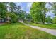 The house features a well-manicured lawn at 3497 Glensford Dr, Decatur, GA 30032
