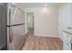 Spacious kitchen featuring stainless steel refrigerator with a view to an adjacent room at 3497 Glensford Dr, Decatur, GA 30032