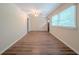 Bright living room with wood-look flooring, a ceiling fan, and natural light from the windows at 3497 Glensford Dr, Decatur, GA 30032