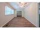 Inviting living room featuring wood-look flooring and a large window at 3497 Glensford Dr, Decatur, GA 30032