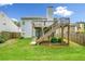 Green backyard with a two-level wooden deck, perfect for entertaining at 1452 Evanston Ln, Marietta, GA 30062