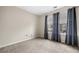 Comfortable bedroom with carpet, neutral walls, ample light and a window with decorative curtains at 1452 Evanston Ln, Marietta, GA 30062