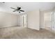 Large bedroom with neutral paint, carpet flooring, and access to walk-in closet and an adjacent room at 1452 Evanston Ln, Marietta, GA 30062