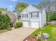 Charming two-story home with a two car garage and well-manicured landscaping at 1452 Evanston Ln, Marietta, GA 30062