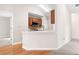 Bright kitchen area with wood floors, stainless steel appliances, and breakfast bar at 1452 Evanston Ln, Marietta, GA 30062