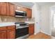 Updated kitchen with stainless steel appliances, light counter tops, and wood cabinetry at 1452 Evanston Ln, Marietta, GA 30062