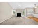 Bright and airy living room with fireplace, ceiling fan, and access to a deck at 1452 Evanston Ln, Marietta, GA 30062