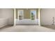 Bright living room features chair rail, large windows, and neutral color palette at 1452 Evanston Ln, Marietta, GA 30062