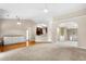 Open-concept living room boasts hardwood floors, fireplace, and an abundance of natural light at 1452 Evanston Ln, Marietta, GA 30062