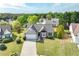 An aerial perspective shows the home's location in a peaceful neighborhood with mature trees and well-maintained lawns at 2602 Midler Ct, Buford, GA 30519