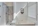 Bright bathroom featuring a garden tub, tiled shower, and a large window, creating a relaxing spa-like atmosphere at 2602 Midler Ct, Buford, GA 30519
