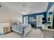 Spacious bedroom with vaulted ceiling, large windows, and blue accent wall at 2602 Midler Ct, Buford, GA 30519