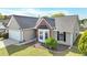 Charming single-story home featuring a well-manicured lawn and attached two-car garage at 2602 Midler Ct, Buford, GA 30519