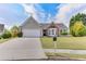 Lovely single-Gathering home boasts pristine landscaping, attached garage and quaint curb appeal at 2602 Midler Ct, Buford, GA 30519