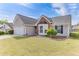 Beautiful home with well maintained lawn, two car garage, and brick accent at 2602 Midler Ct, Buford, GA 30519