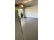 Clean, spacious two-car garage with gray painted floor, overhead lighting, and plenty of room for storage at 2602 Midler Ct, Buford, GA 30519