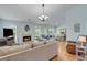 Inviting living room with hardwood floors, a fireplace, and lots of natural light at 2602 Midler Ct, Buford, GA 30519