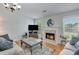 This spacious living room is bright and airy, featuring hardwood floors and a fireplace, perfect for Gathering gatherings at 2602 Midler Ct, Buford, GA 30519