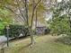 Charming home with lush landscaping and inviting front entrance with wooden stairs at 3220 Stoney Acres Nw Dr, Kennesaw, GA 30152