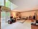 Bright living room with large windows, slider to deck, and neutral tones at 3220 Stoney Acres Nw Dr, Kennesaw, GA 30152