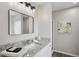 Modern bathroom features a granite countertop, framed mirror, and glass door shower at 5447 Lauren Cv, Ellenwood, GA 30294