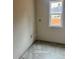Bathroom features gray tile flooring and a window at 816 Proctor Rd, Rockmart, GA 30153