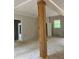 Open-concept living space featuring a large wood column, with large openings for plenty of natural light at 816 Proctor Rd, Rockmart, GA 30153
