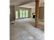 A bright, spacious living room featuring large windows, a fireplace, and an open-concept design at 816 Proctor Rd, Rockmart, GA 30153