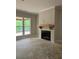 A living room featuring a fireplace, large windows, and an open concept design at 816 Proctor Rd, Rockmart, GA 30153