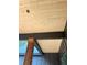 A porch ceiling with wood paneling detail, brown beams and wooden pillars for structural support at 816 Proctor Rd, Rockmart, GA 30153