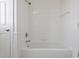 A bathroom features a white tiled shower and tub at 4100 Paces Se Walk # 4306, Atlanta, GA 30339