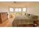 Cozy bedroom with hardwood floors and bay windows showcasing a beautiful wooded backdrop at 4100 Paces Se Walk # 4306, Atlanta, GA 30339