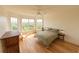 Light filled bedroom with hardwood floors and large windows offering scenic views at 4100 Paces Se Walk # 4306, Atlanta, GA 30339