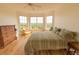 A bright bedroom features hardwood floors and bay windows with scenic outdoor views at 4100 Paces Se Walk # 4306, Atlanta, GA 30339