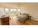 Bright bedroom with hardwood floors, ceiling fan, and scenic outdoor views at 4100 Paces Se Walk # 4306, Atlanta, GA 30339