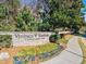 Community sign that reads 'Vinings Vineyard Condominiums' with colorful flowerbeds at 4100 Paces Se Walk # 4306, Atlanta, GA 30339