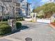 Elegant entrance to the community featuring stone pillars, a gated entrance, and a beautifully paved driveway at 4100 Paces Se Walk # 4306, Atlanta, GA 30339