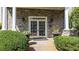 Elegant entrance with stone columns, double doors, and manicured greenery at 4100 Paces Se Walk # 4306, Atlanta, GA 30339