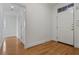 Bright entryway features hardwood floors, white walls, and transom window over door at 4100 Paces Se Walk # 4306, Atlanta, GA 30339
